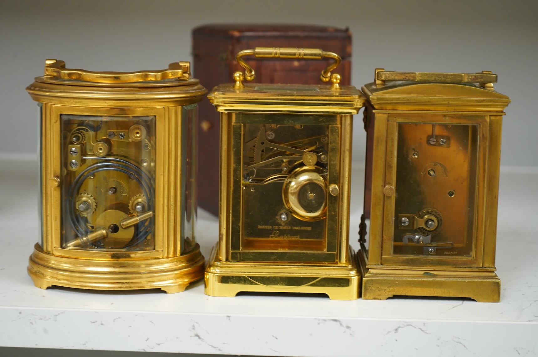 Two carriage clocks and a timepiece, tallest 12.5cm